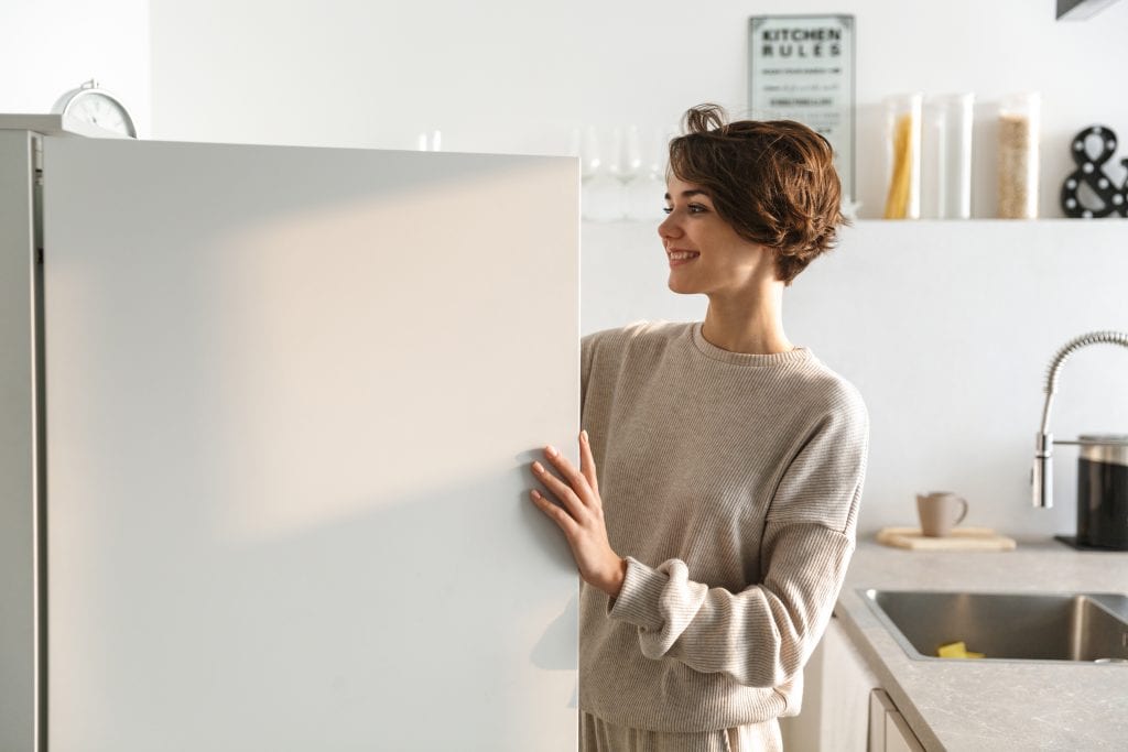 Woman looking into a fridge