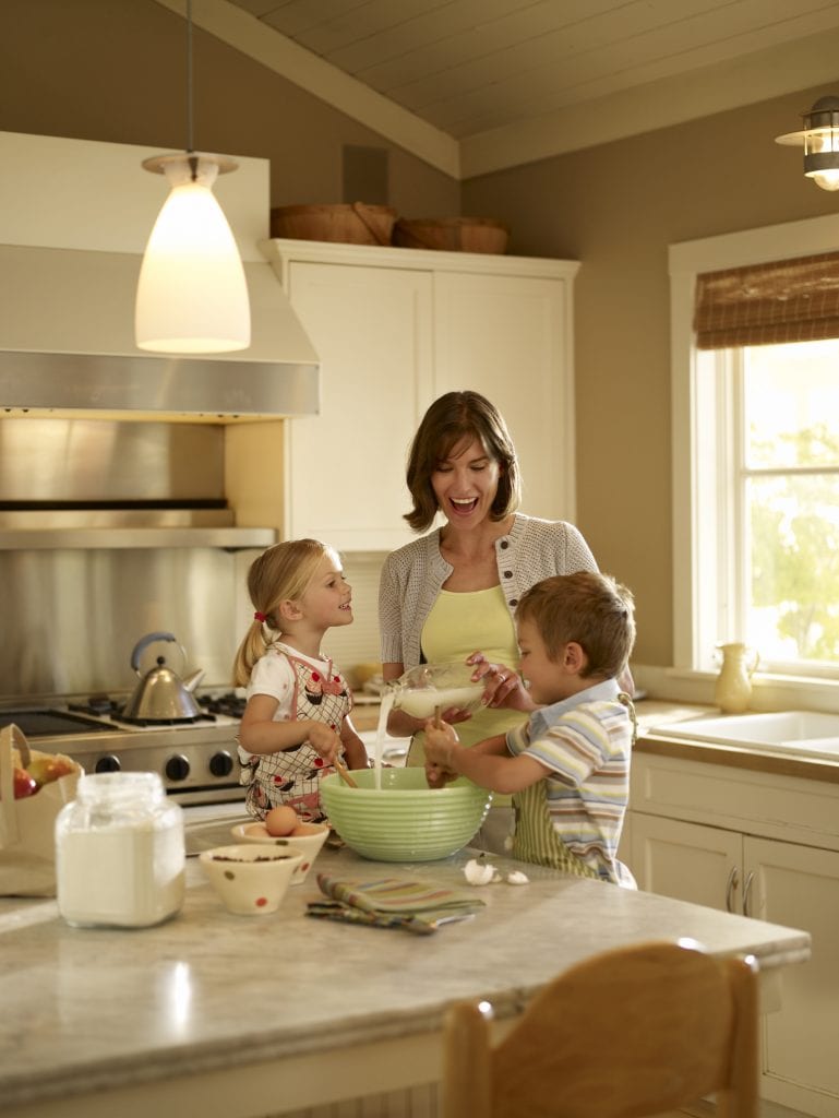 Woman baking with her children