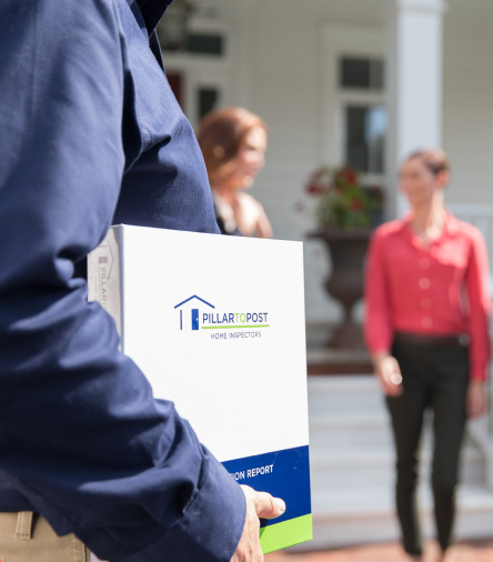 Home Inspector holding a binder with the home inspection report