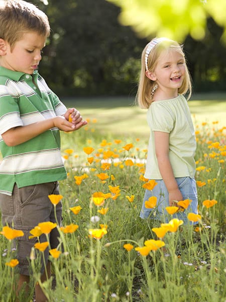 Children in a field of flowers